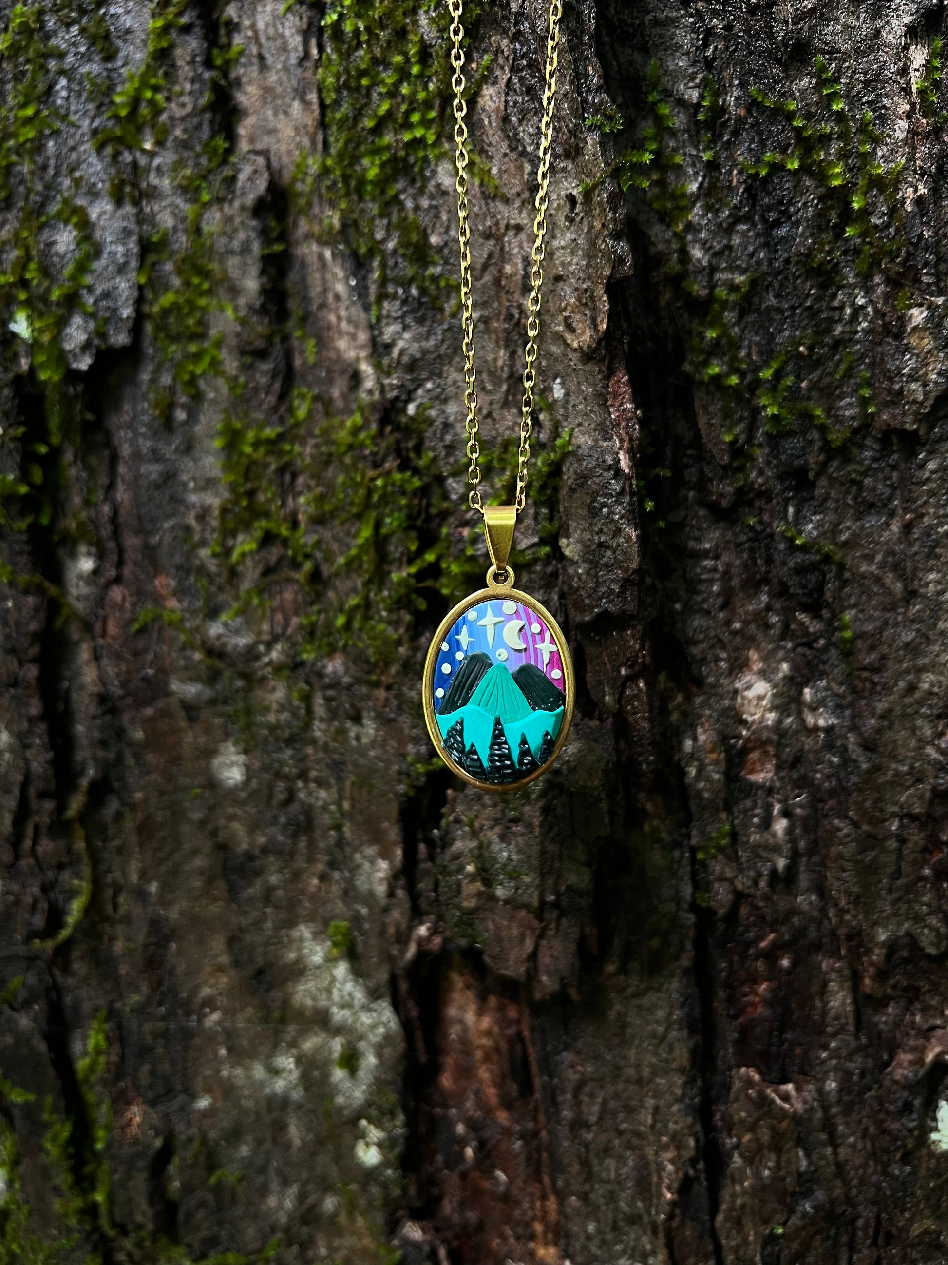 Necklace with a colorful pendant on a textured wooden surface