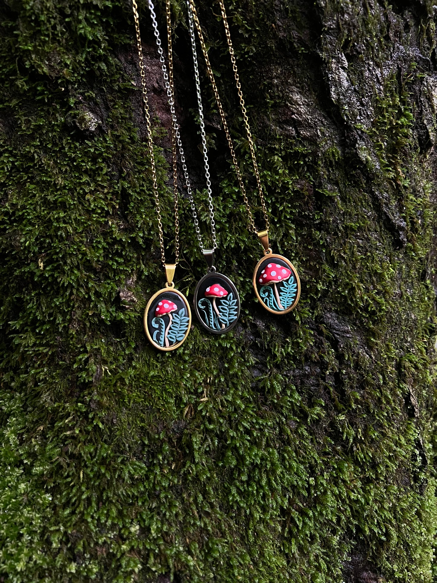 Mushroom Necklaces on a mossy surface
