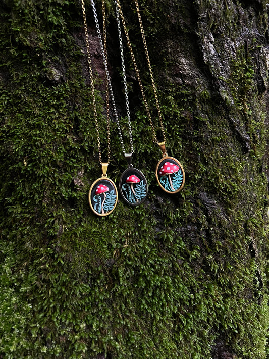 Mushroom Necklaces on a mossy surface