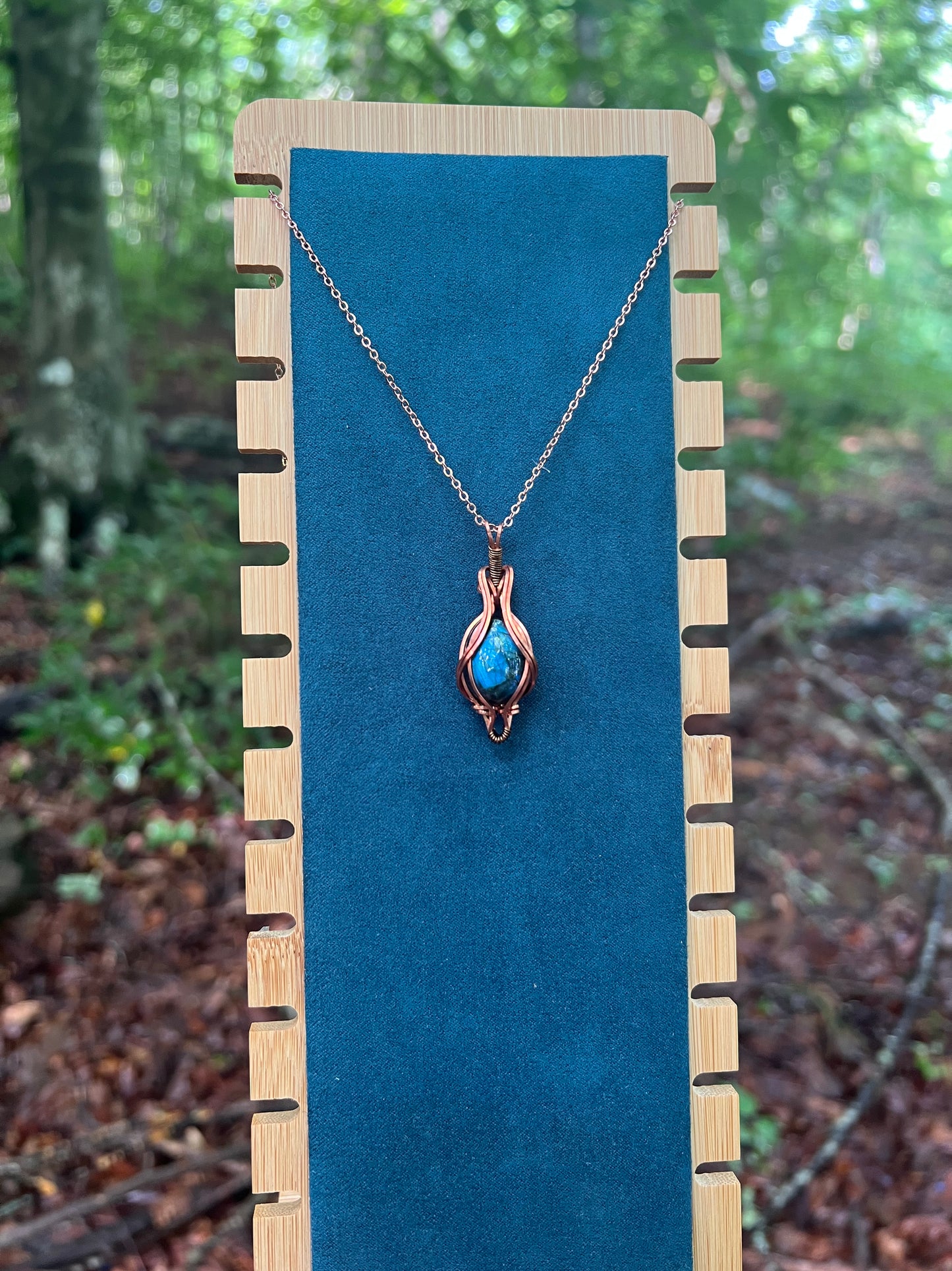 Wire Wrapped Blue Labradorite Necklace against a natural background
